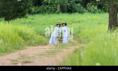 Portrait of Vietnamese girl traditional dress, Ao dai is famous traditional costume for woman in Vietnam Stock Photo