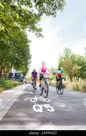 Cyclists use the Quietway 5 cycle route through Vauxhall Pleasure Gardens. Stock Photo