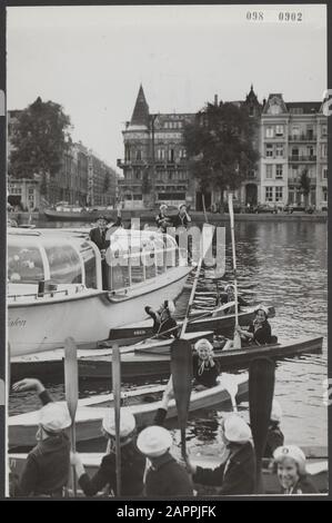 Girls Boy Scouts bring a greeting from their boats to Lady Baden-Powell who is in a canal boat Date: 20 August 1954 Location: Amsterdam, Noord-Holland Keywords: visits, boats, Boy Scout, Boy Scouts, sightseeing boats Personal name: Baden-Powell Stock Photo