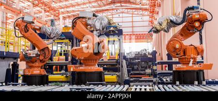 welding robots in a car manufacturer factory Stock Photo
