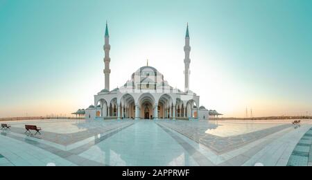 Sharjah Mosque Largest mosque in Dubai, beautiful traditional Islamic architecture Design, best Travel and tourism spot colorful sunset mosque view Stock Photo