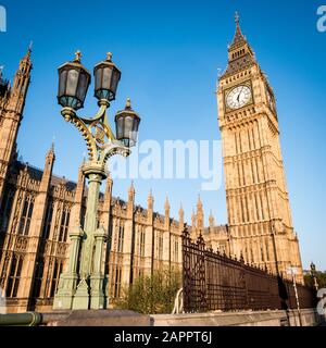 Big Ben and the Palace of Westminster. Low angle view of the famous clock tower London landmark in the early morning sun. Stock Photo