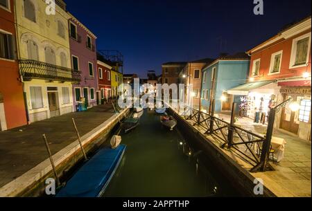 Colourfully painted houses facade on Burano island in evening Stock Photo