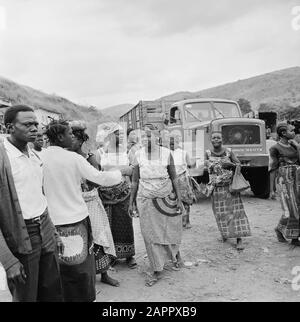Zaire (formerly Belgian Congo)  Group of people on the road in the countryside Date: 24 October 1973 Location: Congo, Zaire Keywords: trucks, roads Stock Photo