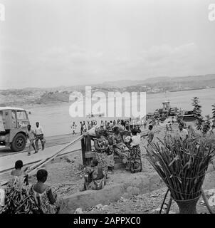 Zaire (formerly Belgian Congo)  Group of people at a mooring site in a river Date: October 24, 1973 Location: Congo, Zaire Keywords: rivers, shipping, transport Stock Photo