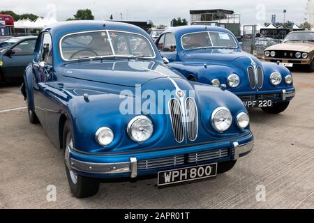 Three-quarters front view of two, Blue 1954 Bristol 403's,on display in the Bristol Owners Club Zone of the 2019 Silverstone Classic Stock Photo
