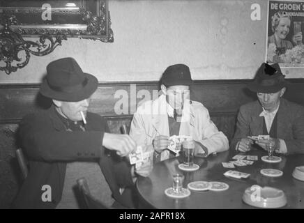 Visit to Prime Minister Hedtoft and his family  Ella Hedtoft sitting on the couch with a dog Date: March 1954 Location: Denmark, Copenhagen Keywords: sofas, dogs, living rooms, interiors, furniture, housing Personal name: Hedtoft, Ella Stock Photo