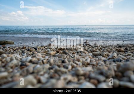 Close up of rounded and polished beach rocks. Pebble stones at the sea, Colorful Pebble Stones. Stock Photo
