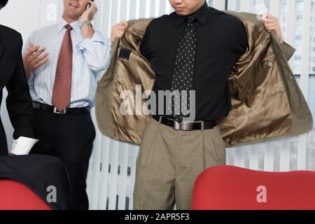 View of architects standing near window. Stock Photo