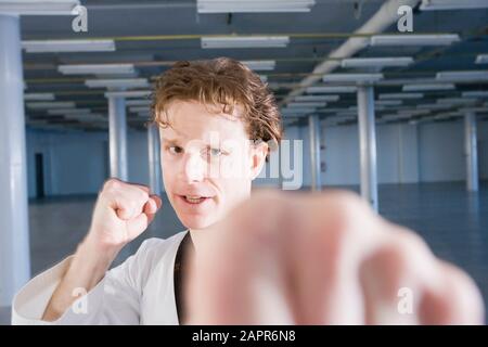 Young man practicing karate Stock Photo