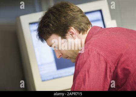 Close-up of a mid adult man working in a control room Stock Photo