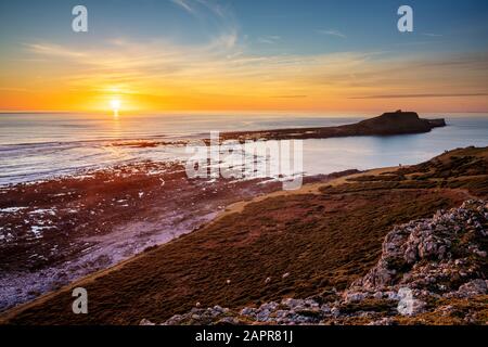 Worm's head Rhossili Bay at sunset on the Gower peninsula an AONB  West Glamorgan South Wales UK GB Europe