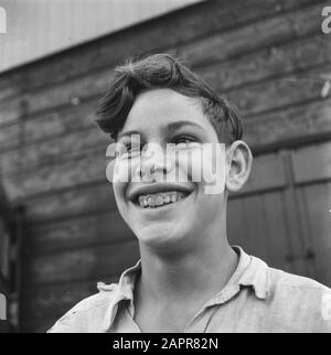 The work of the Stichting War Foster Children on the care of children of N.S.B.-ers  Portrait of a smiling and squint looking boy Date: October 1945 Keywords: education, second world war Stock Photo