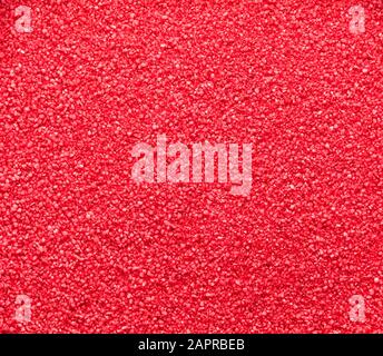 Small Bright Red Fish Tank Gravel Background. Stock Photo