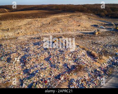 Top down aerial image of a Municipal Solid waste Landfill during collecting, sorting and pressing work.Burgas,Bulgaria Stock Photo