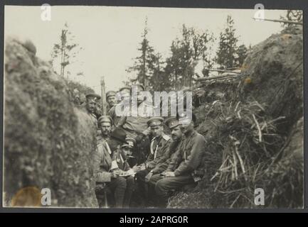 Dutch Ambulance at St. Petersburg  Philips Fisherman (sitting second from left) in a trench with a number of Russian oficiers Date: 1916 Location: Russia (until 1917) Keywords: trenches, military personname: Fisherman, Ph.C. Stock Photo