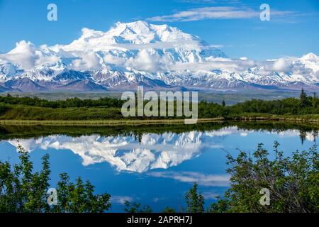 View of Denali and it's reflection in Reflection Pond taken from the park road while driving to Wonder Lake, Denali National Park and Preserve Stock Photo