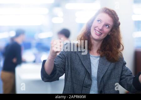 employee in an office excited and happy Stock Photo