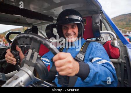 Disabled race car driver in modified car Stock Photo