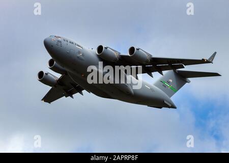 LEEUWARDEN, THE NETHERLANDS - MAY 5, 2015: US Air Force Boeing C-17 Globemaster III transport plane taking off from Leeuwarden Airbase. Stock Photo