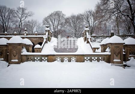 Beautiful shot of stairs covered in a snow in the park Stock Photo
