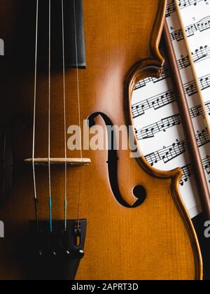 Cropped Image Of Violin Against Black Background Stock Photo