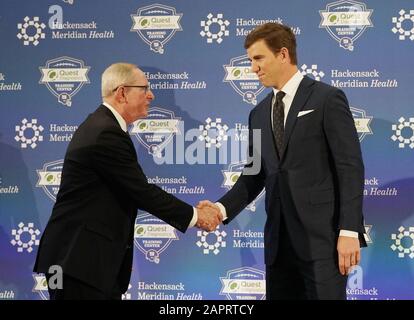 East Rutherford, United States. 24th Jan, 2020. New York Giants Eli Manning shakes hands with coach Tom Coughlin at a press conference announcing his retirement from playing quarterback in the NFL at the Quest Diagnostics Training Center near MetLife Stadium in East Rutherford, New Jersey on Friday, January 24, 2020. Manning is two-time Super Bowl winner and most valuable player. He announced his retirement Friday ending a 16-year career spent entirely with the New York Giants. Photo by John Angelillo/UPI Credit: UPI/Alamy Live News Stock Photo