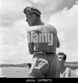 Dutch Antilles and Suriname at the time of the royal visit of Queen Juliana and Prince Bernhard in 1955  A diver on a boat in the Fuik Bay Date: October 1955 Location: Curaçao Keywords : divers, ships Stock Photo