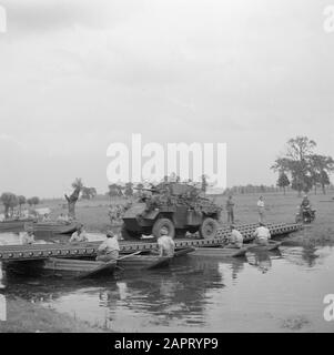 Military Reportage  A military exercise. A river must be crossed. An armored car drives over the constructed pontoon bridge Annotation: Subject a Humber Mk IV Armoured Car Date: 1939 Keywords: military exercises Stock Photo