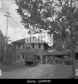 War volunteers in Malacca and Indonesia  A military truck for a building Date: 1946 Keywords: buildings, trucks Stock Photo