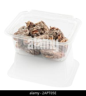 dried persimmon in a plastic food container, isolated on a white background with clipping path Stock Photo