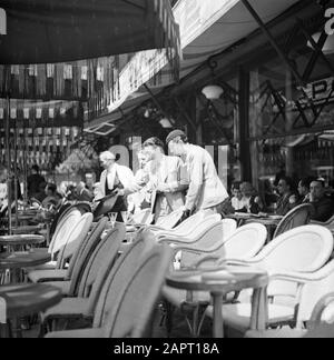 Students at the University of Paris (Sorbonne)  A terrace in Paris, with students Date: 1948 Location: France, Paris Keywords: chairs, students, terraces Stock Photo
