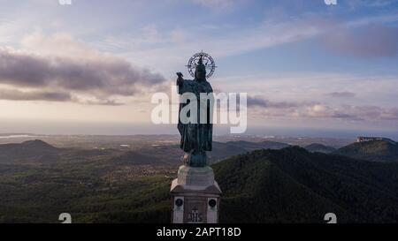 statue of Christ standing on a pedestal, The Balearic islands, Spain Palma de Mallorca, huge old statue on a hill during sunrise early in the morning Stock Photo