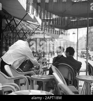 Students at the University of Paris (Sorbonne)  A terrace in Paris, with students and a waiter Date: 1948 Location: France, Paris Keywords: waiters, students, terraces Stock Photo
