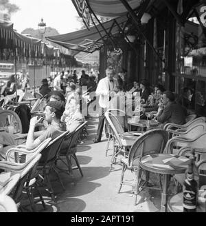 Students at the University of Paris (Sorbonne)  A terrace in Paris, with students and a waiter Date: 1948 Location: France, Paris Keywords: waiters, students, terraces Stock Photo