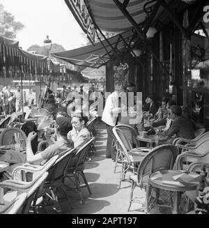 Students at the University of Paris (Sorbonne)  A terrace in Paris, with students Date: 1948 Location: France, Paris Keywords: waiters, students, terraces Stock Photo