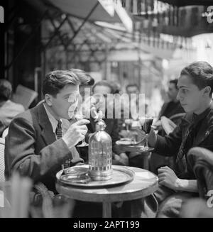 Students at the University of Paris (Sorbonne)  A terrace in Paris, with students Date: 1948 Location: France, Paris Keywords: students, syphons, terraces Stock Photo