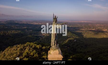 statue of Christ standing on a pedestal, The Balearic islands, Spain Palma de Mallorca, huge old statue on a hill during sunrise early in the morning Stock Photo