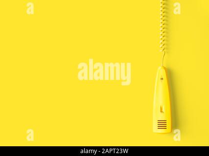 Retro phone reciever on yellow background. with clipping path Stock Photo