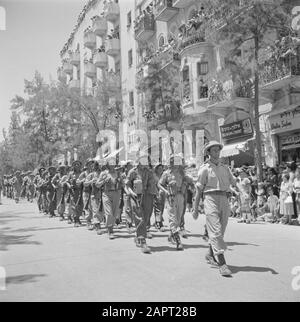 Israel 1948-1949: Jerusalem  Infantry Unit during the military parade on May 15, 1949 in Jerusalem on the occasion of the first anniversary of Israel's independence Date: 23 Apr 1950 Location: Israel, Jerusalem Keywords: trees, condominiums, military parades, national holidays, uniforms, weapons Stock Photo