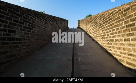 A passage through the fort walls of the ancient Portuguese built Diu fort in the island of Diu in India. Stock Photo