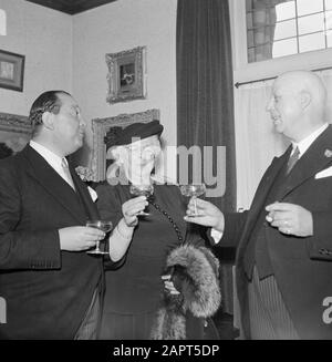 50th anniversary cigar factory Karel I Eindhoven  Factory director Jan van Abbe (left) in conversation with a cigar-smoking man and a woman Date: 1 January 1950 Location: Eindhoven Keywords: directors, drinks, factories, cigars, tobacco industry Personal name: Abbe, Jan van Stock Photo