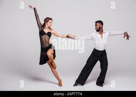 couple dancers posing over white background dance school concept 2apt7t4
