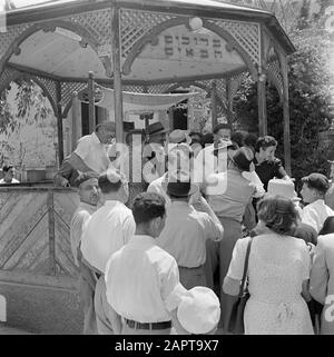 Israel 1948-1949: marriages at Lag BaoMer  Congratulations after the wedding ceremony, presumably in Haifa Annotation: Lag BaoMer (also Lag Baomer, Lag BaoMer, Lag B'Omer) is a day on which traditionally marriages are concluded Date: 1948 Location: Haifa, Israel Keywords: weddings, happiness, marriages, kisses, religious holidays Stock Photo