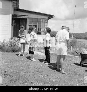 Netherlands Antilles and Suriname at the time of the royal visit of Queen Juliana and Prince Bernhard in 1955  Company at a strain on the Fuik Bay Date: October 1955 Location: Curaçao Keywords: Catering facilities Stock Photo