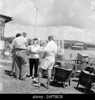 Netherlands Antilles and Suriname at the time of the royal visit of Queen Juliana and Prince Bernhard in 1955  Company at a strain on the Fuik Bay Date: October 1955 Location: Curaçao Keywords: Catering facilities Stock Photo