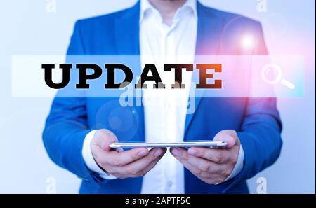 Word writing text Update. Business photo showcasing make something more modern or up to date like software programs Man in the blue suite and white sh Stock Photo