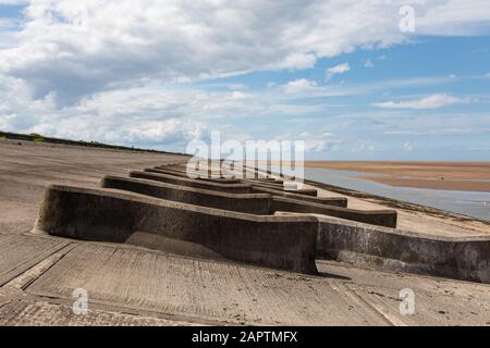 Concrete breakers on the beach Leasowe Wirral June 2019 Stock Photo