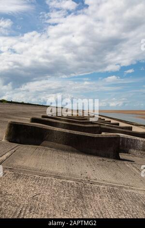 concrete breakers on the beach Leasowe Wirral June 2019 Stock Photo