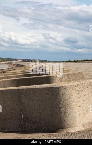 concrete breakers on the beach leasowe wirral 2019 Stock Photo